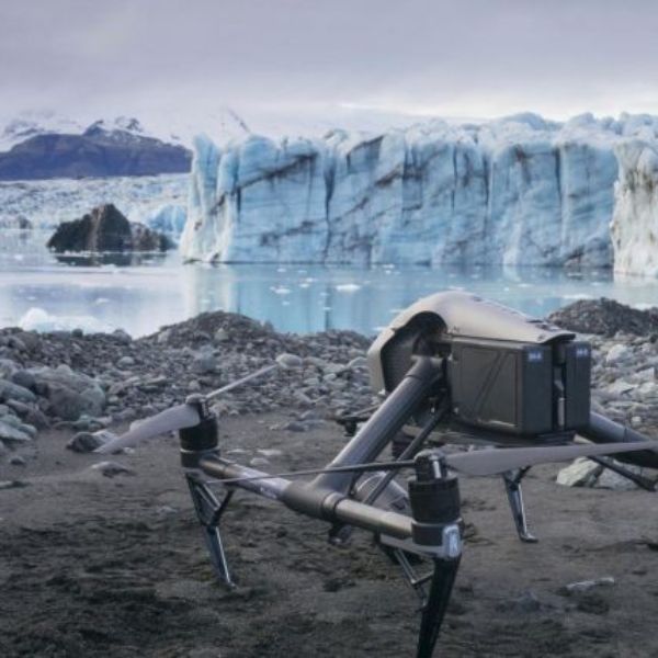 A survey drone on expedition in front of a glacier