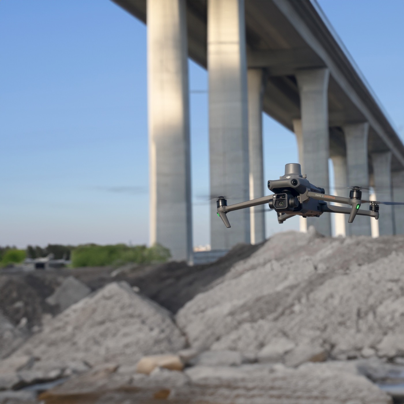 A drone flying an inspection over a large bridge